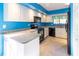 Modern kitchen with granite countertops and black appliances at 4542 Ne 4Th St, Ocala, FL 34470