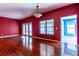 Living room with a window, French doors and hardwood floors at 4542 Ne 4Th St, Ocala, FL 34470