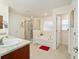 Elegant bathroom with soaking tub, walk-in shower, and double vanity at 4585 Sw 112Th Ln, Ocala, FL 34476