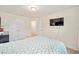 Spacious bedroom with a queen bed and double doors at 4585 Sw 112Th Ln, Ocala, FL 34476