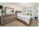 Bright bedroom with a comfortable bed and ample dresser storage at 4585 Sw 112Th Ln, Ocala, FL 34476