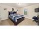 Bedroom with a full bed and built-in shelving at 4585 Sw 112Th Ln, Ocala, FL 34476