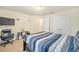Serene bedroom with a full bed and walk-in closet at 4585 Sw 112Th Ln, Ocala, FL 34476