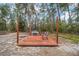 Wooden deck with grill and seating, perfect for outdoor dining at 4585 Sw 112Th Ln, Ocala, FL 34476