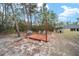 Relaxing wooden deck with grill and seating in wooded backyard at 4585 Sw 112Th Ln, Ocala, FL 34476