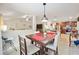 Open dining area with table and chairs, looking towards kitchen at 4585 Sw 112Th Ln, Ocala, FL 34476