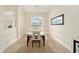 Bright dining room with a table set for six and large window at 4585 Sw 112Th Ln, Ocala, FL 34476
