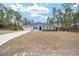 One-story home with gray siding, gray roof, and a two-car garage at 4585 Sw 112Th Ln, Ocala, FL 34476