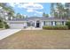 One-story home with gray siding, gray roof, and a two-car garage at 4585 Sw 112Th Ln, Ocala, FL 34476