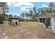 Backyard view of house, showing screened porch and shed at 4585 Sw 112Th Ln, Ocala, FL 34476