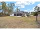 House exterior with large backyard and screened in porch at 4585 Sw 112Th Ln, Ocala, FL 34476