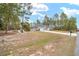 Single story home with gray siding and a large yard at 4585 Sw 112Th Ln, Ocala, FL 34476