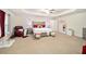 Large main bedroom with plush carpeting and a ceiling fan at 4585 Sw 112Th Ln, Ocala, FL 34476