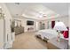Main bedroom with a king-size bed and large TV at 4585 Sw 112Th Ln, Ocala, FL 34476