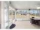 Relaxing screened porch with seating area and view of backyard at 4585 Sw 112Th Ln, Ocala, FL 34476