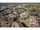 Aerial view showing community buildings, landscaping, and a pool at 512 Bahia Cir # 512B, Ocala, FL 34472