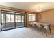 Bright dining room with sliding glass doors leading to a balcony at 512 Bahia Cir # 512B, Ocala, FL 34472