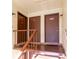 Condo building entry with three doors and stairs at 512 Bahia Cir # 512B, Ocala, FL 34472