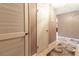 Apartment hallway with light brown flooring and louvered doors at 512 Bahia Cir # 512B, Ocala, FL 34472