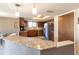 Kitchen with breakfast bar and view into dining area at 512 Bahia Cir # 512B, Ocala, FL 34472