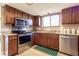 Updated kitchen with stainless steel appliances and granite countertops at 512 Bahia Cir # 512B, Ocala, FL 34472