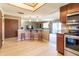 Kitchen with breakfast bar and view into living room at 512 Bahia Cir # 512B, Ocala, FL 34472