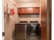 Laundry room with washer, dryer, and ample storage shelving at 512 Bahia Cir # 512B, Ocala, FL 34472