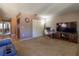 Living room with TV, louvered doors, and a home office area at 512 Bahia Cir # 512B, Ocala, FL 34472