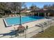 Refreshing community pool with patio furniture and cabana at 512 Bahia Cir # 512B, Ocala, FL 34472
