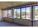 Sunroom with large windows offering scenic views of the community at 512 Bahia Cir # 512B, Ocala, FL 34472