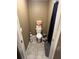 Small bathroom with toilet and shower at 6701 Se 122Nd Ln, Belleview, FL 34420