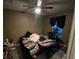 Main bedroom with a large bed and TV at 6701 Se 122Nd Ln, Belleview, FL 34420