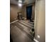 Spacious bedroom with wood-look flooring at 6701 Se 122Nd Ln, Belleview, FL 34420