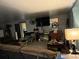 Living room with sectional sofa and large TV at 6701 Se 122Nd Ln, Belleview, FL 34420