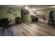 Bright living room with hardwood floors and ceiling fan at 6701 Se 122Nd Ln, Belleview, FL 34420