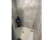 Shower with gray tile and storage shelf at 6701 Se 122Nd Ln, Belleview, FL 34420