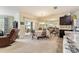 Bright dining room with table and chairs, adjacent to kitchen at 6970 Sw 64Th Ter, Ocala, FL 34476