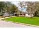 Cute house on a tree-lined street with a spacious lawn at 727 Se 12Th St, Ocala, FL 34471