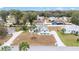 Aerial view of a neighborhood with well-maintained lawns and mature trees at 7528 Sw 102Nd Loop, Ocala, FL 34476