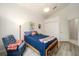 Comfortable bedroom with vaulted ceiling, hardwood floors, natural light, and spacious closet at 7528 Sw 102Nd Loop, Ocala, FL 34476