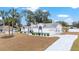 Well-maintained single-story home with attached garage, long driveway and manicured lawn at 7528 Sw 102Nd Loop, Ocala, FL 34476