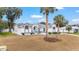 Spacious single-story home with manicured lawn and mature palm trees at 7528 Sw 102Nd Loop, Ocala, FL 34476