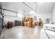 Spacious garage with ample storage, featuring an open layout, a working door, and a clean concrete floor at 7528 Sw 102Nd Loop, Ocala, FL 34476