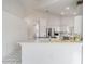 Bright kitchen featuring all white cabinets, stainless steel appliances, and a breakfast bar at 7528 Sw 102Nd Loop, Ocala, FL 34476