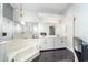 Elegant main bathroom features a jetted tub, a chandelier, and and sinks at 7528 Sw 102Nd Loop, Ocala, FL 34476
