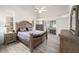 Spacious main bedroom features an ensuite bathroom and sliding glass doors leading to the lanai at 7528 Sw 102Nd Loop, Ocala, FL 34476
