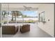 Relaxing screened patio with comfortable wicker seating and a view of the manicured backyard and landscaping at 7528 Sw 102Nd Loop, Ocala, FL 34476
