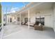 Expansive covered patio providing ample space for outdoor entertaining and comfortable seating arrangements at 7528 Sw 102Nd Loop, Ocala, FL 34476
