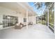 Spacious screened patio with comfortable seating, perfect for enjoying the outdoors in a relaxed setting at 7528 Sw 102Nd Loop, Ocala, FL 34476