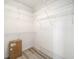 Spacious walk-in closet provides ample storage with wire shelving for clothing and accessories at 7528 Sw 102Nd Loop, Ocala, FL 34476